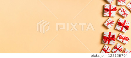 Holiday composition of gift boxes with red hearts on colorful background with empty space for your design. Top view of Valentine's Day concept 122136794