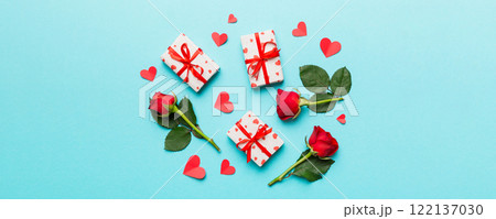 Kraft Gift box with beautiful red ribbon and rose, concept of Valentine day, anniversary, mother day and birthday greeting, copy space, top view 122137030
