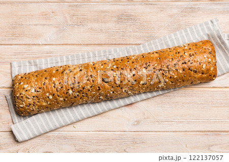 fresh crunchy french baguette on colored table. Top view Bakery products fresh crunchy french baguette on colored table. Top view Bakery products 122137057
