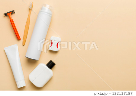 Composition with bath cosmetics on table. razor, toothpaste, soap, gel, toothbrush, mouthwash and other various accessories. Cosmetics for skin health. Bath Mockup for your logo 122137187