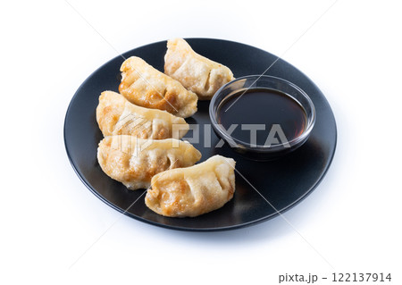 Fried dumplings gyoza isolated on white background Fried dumplings gyoza isolated on white background 122137914