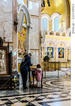 Belgrade, Serbia- 10162024: The Temple Of Saint Sava indoor interior, people pray in an Orthodox church, frescoes on the ceilings and walls of the church 122138421