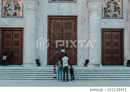 Belgrade, Serbia- 10162024: The Temple Of Saint Sava indoor interior, people pray in an Orthodox church, frescoes on the ceilings and walls of the church 122138431