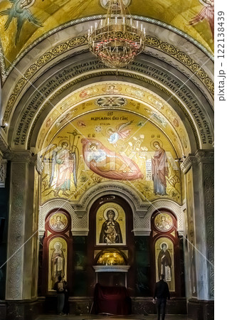 Belgrade, Serbia- 10162024: The Temple Of Saint Sava indoor interior, people pray in an Orthodox church, frescoes on the ceilings and walls of the church 122138439