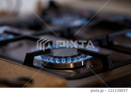 Blue Flame of a Gas Stove Burners in Operation Blue Flame of a Gas Stove Burners in Operation 122139057