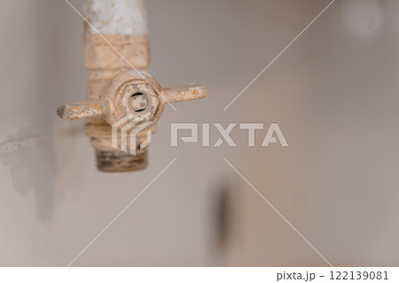 Close-Up of an Old, Rusty Water Tap on a Blurred Background 122139081