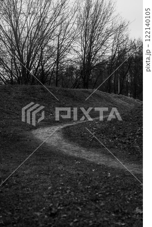 Small hills and a path between them. Black and white photo 122140105