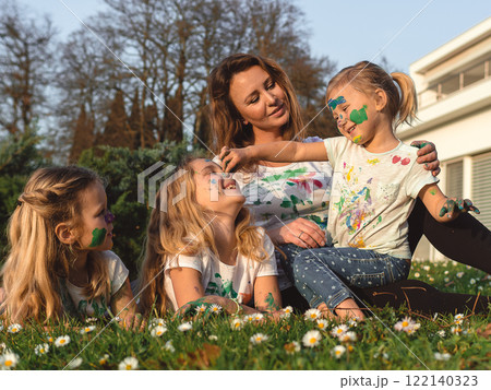 Happy mother and her three daughters 122140323