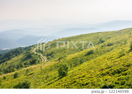 beautiful view of mountain landscape in summer. outdoor adventure. green hill rolling in to the distance in evening light. natural environment of carpathian alps 122140599