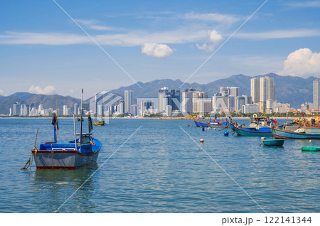 Panoramic daytime view of Nha Trang city, Vietnam. Fishing boats at sea 122141344