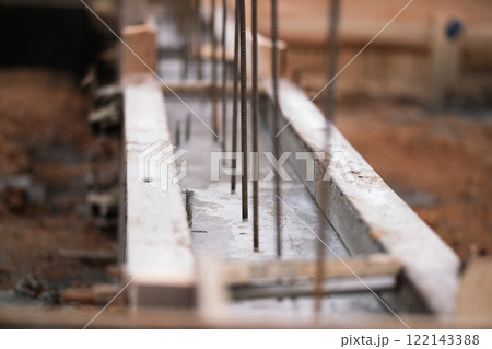 Construction of pile-grillage foundation. Monolithic foundation with metal reinforcement. Monolithic concrete foundation. House construction Construction of pile-grillage foundation. Monolithic foundation with metal reinforcement. Monolithic concrete foundation. House construction 122143388