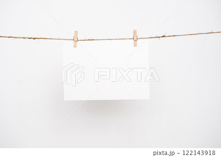 Blank note paper hanging with wooden clips. 122143918
