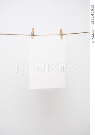 Blank note paper hanging with wooden clips. Blank note paper hanging with wooden clips. 122143919