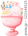 Three flavors of ice cream topped with candy bars and little bunnies. 122144525