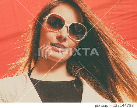 Young fashionable woman posing during sunny day. 122144788