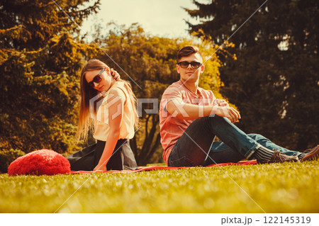 Moody girl with boyfriend in park. Moody girl with boyfriend in park. 122145319