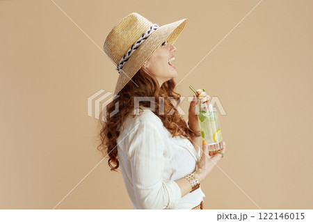 happy trendy housewife in blouse and shorts on beige happy trendy housewife in blouse and shorts on beige 122146015