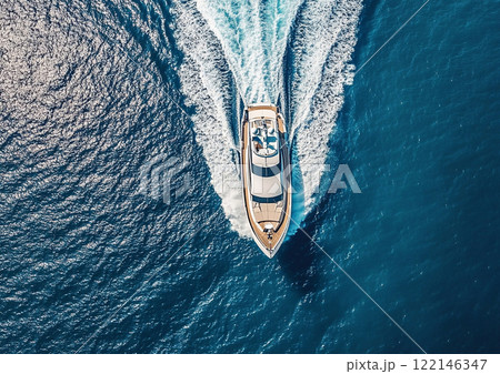 White private yacht boat cruising on sunny summer day leaving trail behind.Top View.AI Generative. White private yacht boat cruising on sunny summer day leaving trail behind.Top View.AI Generative. 122146347