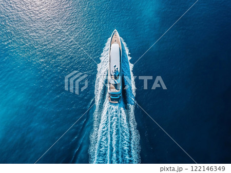 White private yacht boat cruising on sunny summer day leaving trail behind.Top View.AI Generative. White private yacht boat cruising on sunny summer day leaving trail behind.Top View.AI Generative. 122146349