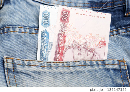 Myanmar kyat in the pocket of blue jeans Myanmar kyat in the pocket of blue jeans 122147323