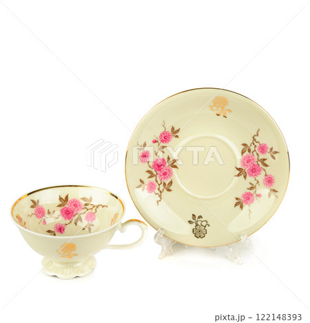 Vintage porcelain cup and saucer isolated on white. Free space for text. Vintage porcelain cup and saucer isolated on white. Free space for text. 122148393