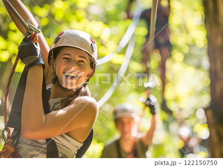 Happy kids in cable park in green forest on summer holiday with lot of acdtivity.AI Generative. 122150750