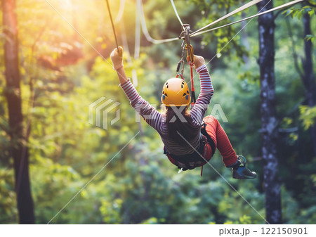 Happy teen girl enjoying her stay in summer camp in cable park in green forest.Macro.AI Generative. 122150901