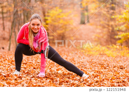 Fit girl doing stretching outdoor. 122151948