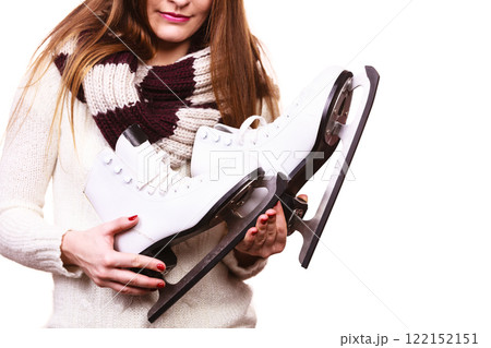 Smiling woman with ice skates 122152151