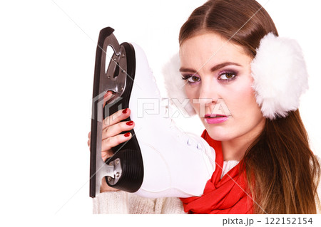 Pensive woman with ice skates Pensive woman with ice skates 122152154