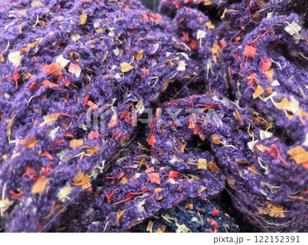 Textured fabric rolls showcase vibrant colors and intricate patterns Textured fabric rolls showcase vibrant colors and intricate patterns 122152391