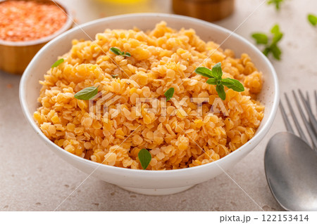 Cooked red lentils in a bowl, vegan protein source Cooked red lentils in a bowl, vegan protein source 122153414