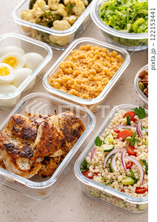 Healthy meal prep with grilled chicken, eggs, lentils, roasted vegetables, nuts and salad 122153441
