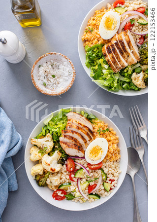 Healthy lunch bowl with grilled chicken, lentils, vegetables and chickpeas, pearl couscous salad Healthy lunch bowl with grilled chicken, lentils, vegetables and chickpeas, pearl couscous salad 122153466