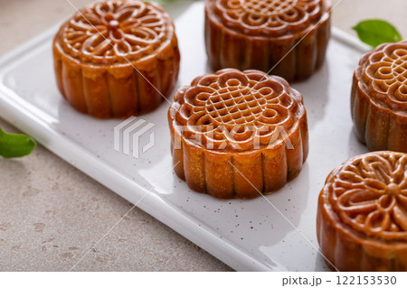 Traditional mooncakes on ceramic plate Traditional mooncakes on ceramic plate 122153530