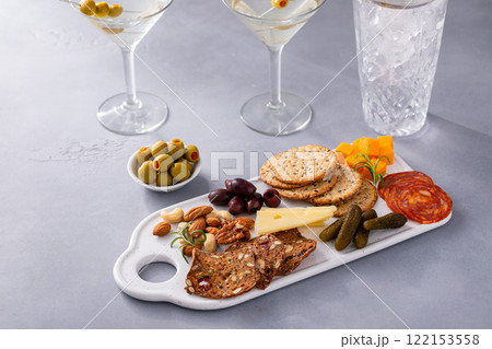 Small charcuterie board for two served with martinis Small charcuterie board for two served with martinis 122153558
