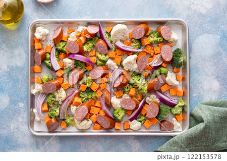 Sheet pan dinner with sausage and vegetables ready to be roasted 122153578