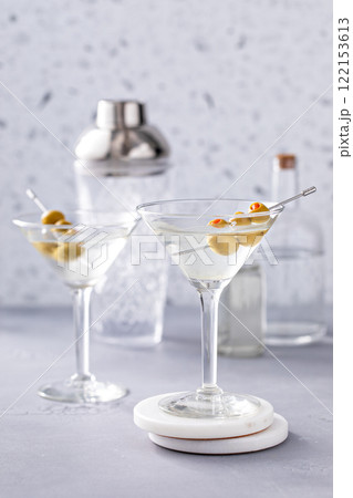 Martini cocktail with vodka, vermouth and olive garnish Martini cocktail with vodka, vermouth and olive garnish 122153613