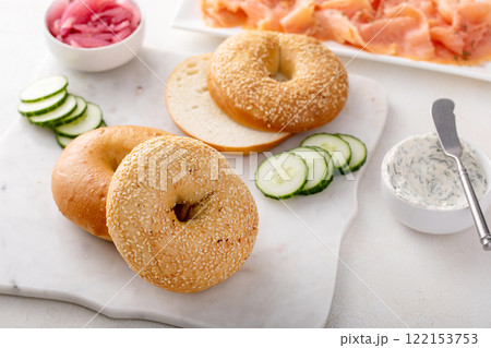 Plain bagels served with smoked salmon, fresh cucumber, red onion and cream cheese Plain bagels served with smoked salmon, fresh cucumber, red onion and cream cheese 122153753