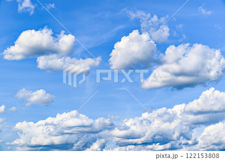 White clouds in a bright blue sky. The beauty of the nature 122153808