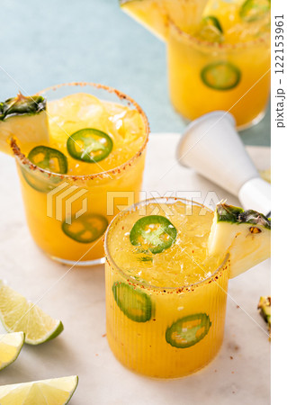 Pineapple margarita with spiced rim and jalapeno slices Pineapple margarita with spiced rim and jalapeno slices 122153961
