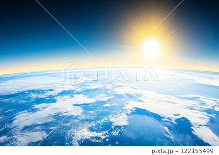 Stunning View of Earth from Space with Sun Rising Over the Horizon in Clear Blue Sky 122155499