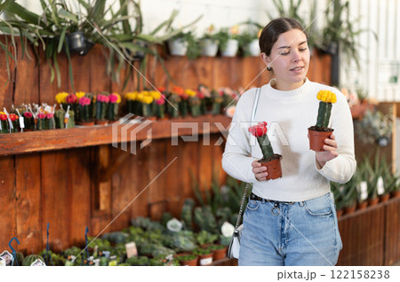 Woman chooses cacti Woman chooses cacti 122158238
