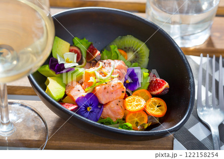 Ceviche of salmon with kiwi fruit, avocado, kumquat, figs Ceviche of salmon with kiwi fruit, avocado, kumquat, figs 122158254