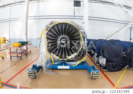 High-bypass turbofan aircraft engine in aviation hangar High-bypass turbofan aircraft engine in aviation hangar 122161395