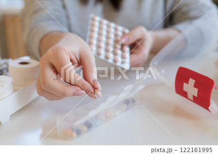 A woman takes her daily sedative or medicine for a headache or stomach pain. A woman takes her daily sedative or medicine for a headache or stomach pain. 122161995