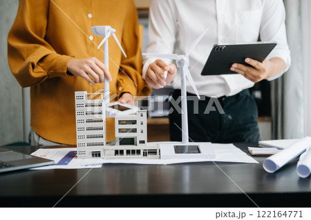 business people working and green renewable energy worker interface. Concept of sustainability business based on renewable in office business people working and green renewable energy worker interface. Concept of sustainability business based on renewable in office 122164771