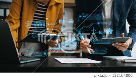 Business team working virtual modern smartphone to reduce CO2 emissions carbon footprint climate change to limit global warming.Sustainable development and green business concept. Business team working virtual modern smartphone to reduce CO2 emissions carbon footprint climate change to limit global warming.Sustainable development and green business concept. 122164800