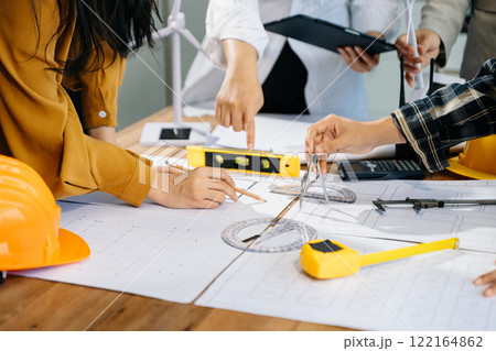 Creative architect projecting on the big drawings with architectural project 122164862