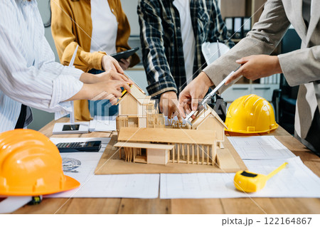 Engineer desk with object paper and tablet with blurry engineer teamwork hardworking 122164867